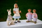 Alice and the White rabbit meet Tweedledum and Tweedledee