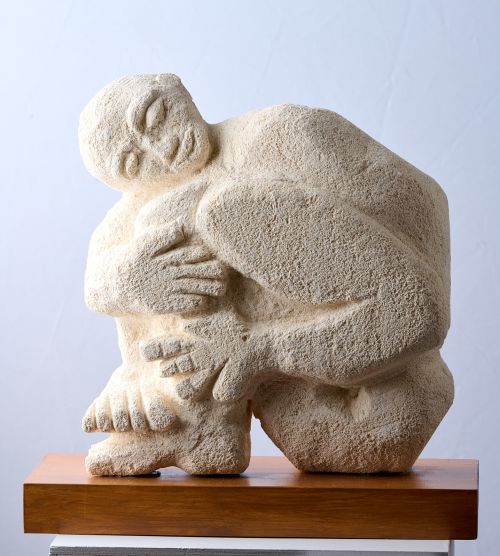 Man hugging his legs sculpture by Eitan Froumine