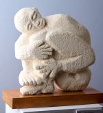 Man hugging his legs