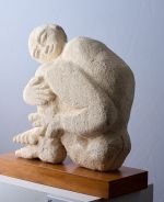 Man hugging his legs