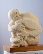 Man hugging his legs