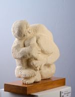 Man hugging his legs